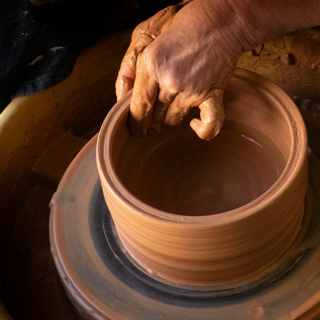 Handmade ceramic vase with organic form and glaze drips